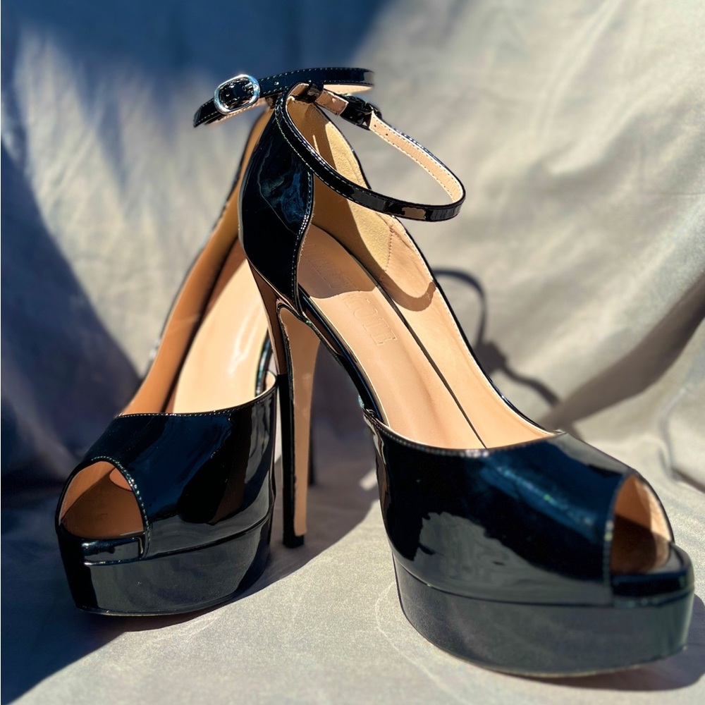 Size 8 1/2 Meromute platform, stiletto heels, Black patent. Never worn.